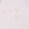 Decorações para nail art em formato de coração oco e estrela de cinco pontas, na cor macaron e transparentes como gelo, pequenos acessórios de resina para DIY de nail art e embelezamentos para unhas