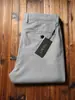 Pantalones casuales rectos holgados de algodón de fibra larga finos de alta gama para hombre, cómodos, combinan con todo, de negocios, sin planchado, primavera y verano 2023