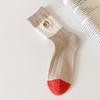 Par calcetines para niños otoño e invierno calcetines de tubo cálidos tendencia bordado calcetines estilo académico para damas calcetines de mujer al por mayor Zhuji
