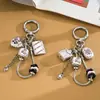 Cadena Personalizada Nueva de Hueso de Serpiente de Metal Colgante Decorativo para Bolso Creativo Cara Sonriente Cuadrada Llavero con Colgante de Perlas