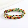 Joyería europea y americana simple moda hecha a mano con cuentas de vidrio cuentas de arroz cadena corporal color combinable cadena de cintura elástica chica popular