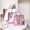 Bolsa de Tienda Libre de Impuestos Láser de Metal Bolsa de Oreja de Horquilla Bolso de Mano Bolsa de Prenda Bolsa de Embalaje de Regalo Material Impermeable Venta al por Mayor