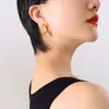 Pendientes de círculo dorado repujado con forma especial de acero de titanio europeo y americano diseño de nicho femenino pendientes de alta calidad pendientes únicos F650