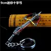Mini armas com tema PUBG, arma modelo em liga em forma de cruz, adereço de metal 9cm
