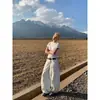Jeans para mujer de diseño retro americano de alta costura 2026, lavados en blanco, tiro alto, corte curvo, pantalones anchos holgados de nicho