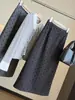 Moderna y elegante falda midi de mezcla de lana con lunares para mujer 2026 Otoño Nueva Cintura Alta Adelgazante Abertura Trasera Ceñida Recta