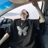 Camiseta Retrô Estilo Americano Manga Curta Masculina Verão 2025 Nova Chegada Estampada de Borboleta Solta High Street Gola Redonda Meia Manga