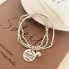 Pulseira com Pingente Redondo Empilhado de Três Camadas Inspirada em Design para Mulheres, Novo Modelo 2026, Luxo Leve, Nicho, Exquisito, Presente para Melhor Amiga