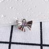 Accesorios de joyería DIY al por mayor, colgante de collar y pendientes de circonita con incrustaciones de lazo nuevo y sencillo, colgante de joyería