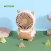 Nuevo ventilador de mano de dibujos animados portátil para exteriores con carga ventilador pequeño para estudiantes niños ventilador eléctrico venta al por mayor de fábrica