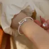Pulsera de perlas retro francesas para mujer, ligera, de lujo, elegante, de alta gama, con diseño de nicho, sencilla y combinable.