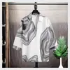 Camisa de manga tres cuartos para jóvenes, verano 2025, nueva camisa estampada de manga corta, holgada, transpirable, marca de moda, tops para hombre