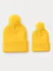 Comercio exterior artículo de venta caliente gorro de punto de color liso con pompón otoño e invierno cálido a prueba de viento gorro de lana rizada para hombre y mujer protección para los oídos al aire libre