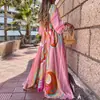 Ropa Femenina Transfronteriza Europea y Americana 2026 Elegante Moda Vestido de Cuello en V Mangas Largas Acampanadas Cintura Alta Suelto Falda Larga Estampada