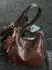 Bolsa tote retrô de alta qualidade para mulheres, grande capacidade, mochila versátil, nova moda 2026, bolsa de ombro e bolsa transversal versátil