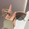 Nuevo marco de metal transfronterizo anti-luz azul fotocromático versátil de ojo de gato, hace que la cara se vea más pequeña, con un diseño hueco de alta gama para mujer