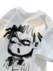 Camiseta de Manga Corta de Algodón Puro con Graffiti Nazha Marca de Tendencia para Hombre Verano 2025 Nueva Camiseta Holgada de Manga Media con Cuello Redondo para Adolescente