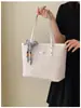 Bolso tote tejido vintage para mujer, modelo nuevo 2026, bolso de mano de gran capacidad para el trabajo con textura de piel sintética, bolso de moda para mujer al por mayor