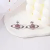 Aretes de punto de fábrica aretes del universo yuan Dorado Azul Rosa sin viento simple estilo de lujo ligero Aretes de Saturno