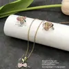 Conjunto de pendientes y collar Xuping estilo vintage de nicho europeo y americano transfronterizo, conjunto de joyería elegante de aleación de cobre, venta al por mayor y hecho a medida