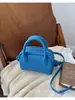 Bolso de mano de nicho transfronterizo para mujer, nuevo bolso de alta gama con patrón de lichi tipo "bolsa de pan tostado", bandolera y bolso cruzado, moderno