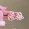 Pendientes de flores de colores 2025, nuevos diseños de nicho con un temperamento avanzado y personalidad única y exagerada para mujeres.