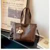 Novo estilo de comércio exterior: bolsa tote retrô, grande capacidade, alça de ombro larga da moda, bolsa transversal, simples e casual, bolsa de ombro versátil para mulheres