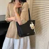 Elegante y texturizada nueva bolsa tote de gran capacidad para ir al trabajo, 2026 bolso de hombro casual con patrón tejido retro para mujer