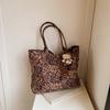 Bolsa Estampa de Leopardo Feminina 2025 Nova Fashionável Portátil Grande Capacidade Bolsa de Trabalho Bolsa de Ombro Estilo Preguiçoso Tendência Bolsa Tote