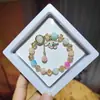Libro Caperucita Roja Mismo Estilo Estudiante Pulsera de Glaseado de Palomitas de Maíz Hecha a Mano con Cuentas Dibujos Animados Cristal Pulsera Infantil Venta al por Mayor Cajas de Regalo
