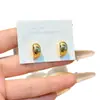 Pendientes de aro lisos curvos estilo indiferente para mujer diseño simple de nicho pendientes con sensación de alta gama pendientes pequeños exquisitos de aro para la oreja