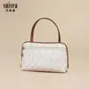 Nova Moda 2025 Design de Nicho Bolsa de Mão Portátil Estampa Floral Antiga Moda Feminina Versátil Armazenamento Bolsa de Viagem