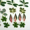 Explosiones calientes de comercio exterior 66 piezas de traje de planta verde artificial hojas de hierba acuática material de corona de ramo de rosas hecho a mano