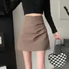 Falda asimétrica plisada de cintura alta estilo nuevo para mujer Verano 2026, falda corta bodycon de línea A, adelgazante y versátil
