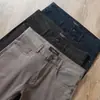 Estación Europea Moda de Verano Combinación Perfecta Algodón Sarga Anti-arrugas Sin Planchado Gama Alta Negocios Hombres Pantalones Vaqueros Rectos Casuales