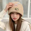 Gorro de punto estilo coreano, mezcla de lana, inspirado en la dopamina, con un lazo, diseñado para mujeres, que proporciona calidez y protección para los oídos en otoño e invierno, adecuado para estudiantes