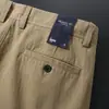 Novas Calças Casuais Listradas Outono/Inverno 2026 Masculinas Textura de Alto Padrão Crocantes e Estilosas Retas Largas Calças Longas Masculinas