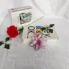 Venta al por mayor en fábrica punto dos capas Phnom Penh flor de Navidad flor de simulación colgante de árbol de Navidad decoración navideña accesorios de corona de flores