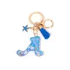 Llavero Colgante Temático Océano Azul con Borla de Estrella de Mar, Llavero de Resina Encanto para Bolso con 26 Letras