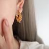Pendientes de mujer con cierre de seguridad en forma de bola de acero personalizado, de estilo europeo y americano, con diseño de nicho, de titanio y acero.