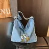 Bolso de hombro moderno y a la moda 2026 nuevo vintage versátil de gran capacidad bandolera para estudiantes, para ir al trabajo y para viajar bolso de mano