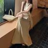 Nuevo y elegante conjunto de estilo coreano, top corto de manga corta de color liso con lazo para mujer, impresionante conjunto de dos piezas con falda de tiro alto para el verano de 2026
