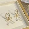 Super hada dulce lazo perla aretes hebilla de oreja populares diseño nicho de lujo ligero temperamento corazón de niña aretes combinables