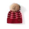Gorro de cachemira para mujer 100% cachemira pura otoño e invierno nuevo estilo moda femenina casual suave pegajoso protección para las orejas gorro a rayas con pompón