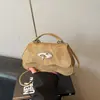 Bolso de hombro casual francés de moda, bolso de verano nuevo, bolso baguette texturizado de nicho, bolso de axila vintage con un toque de alta gama
