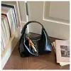 Bolso de mujer transfronterizo otoño e invierno gran capacidad 2026 nuevo estilo nicho bolso de hombro para el trabajo bolso cubo versátil retro
