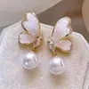 Aretes de Estilo Exótico de Venta Caliente Retro Literario Clásico Dignificado Ganchos para la Oreja Versátil Hueco Moda Borla Colgantes