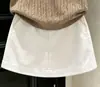 Conjunto de verano 2026 para niñas estilo coreano: top fino de punto con bloques de color en estilo vintage y cuello polo de manga corta, y falda blanca para niñas
