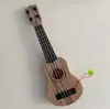 Ukelele para niños guitarra pequeña puede tocar grande, mediano y pequeño simulación niños y niñas Instrumentos musicales y juguetes para bebés al por mayor