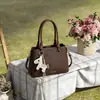 Bolso de Mano de Lujo Texturizado Bolso Cubo 2026 Nueva Moda Versátil para el Trabajo Bolso de Hombro Cruzado Bolso de Mano Simple